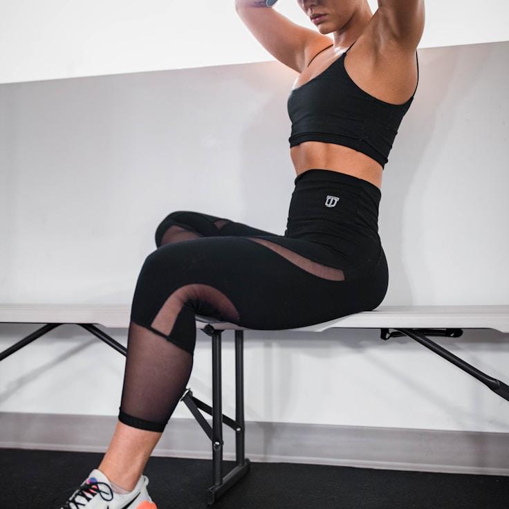 Interior of a professional gym with weight training equipment and mirrors